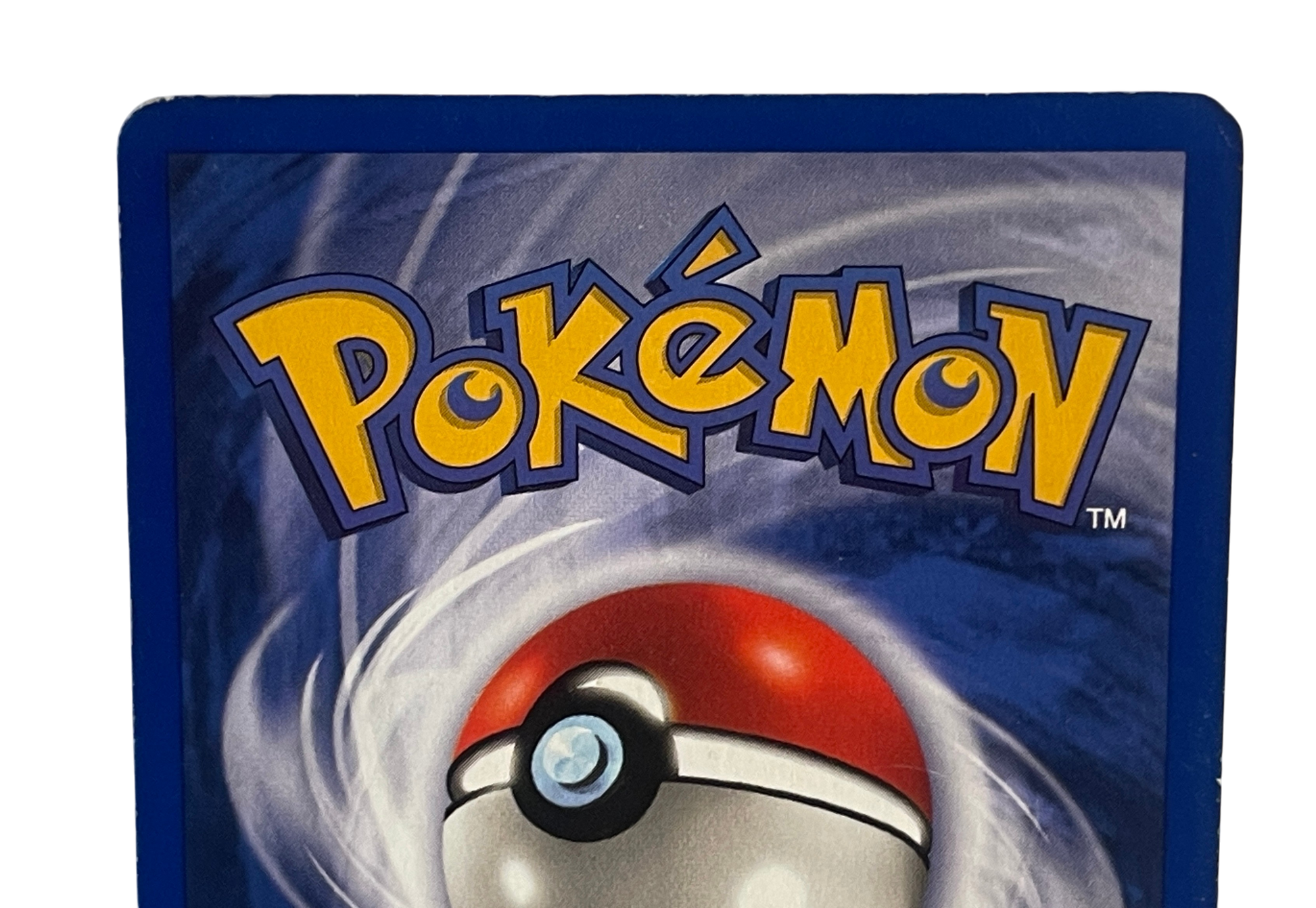 Charizard 4/102 Holo fra Pokémon Base Set – nærbillede af bagsidens øverste kant og hjørner
