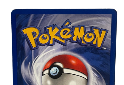 Charizard 4/102 Holo fra Pokémon Base Set – nærbillede af bagsidens øverste kant og hjørner